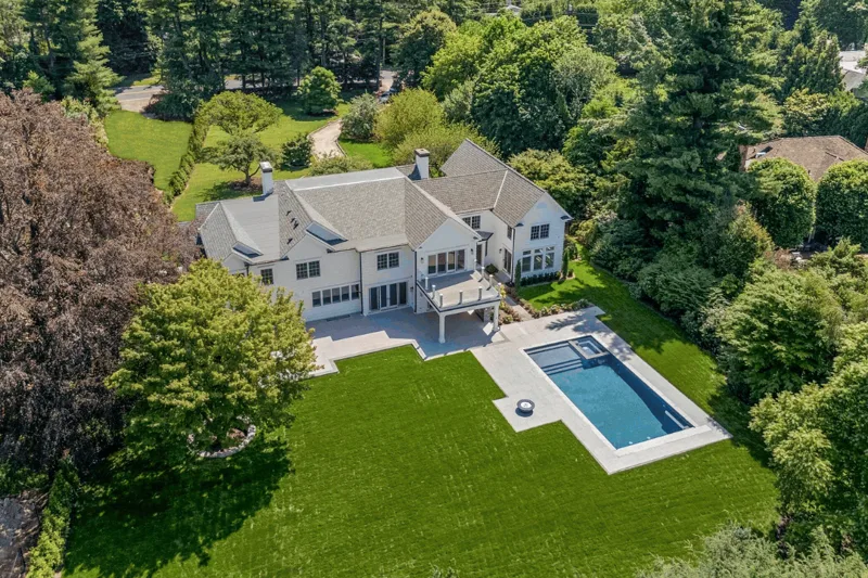 Aerial view of the residence, pool and lawn